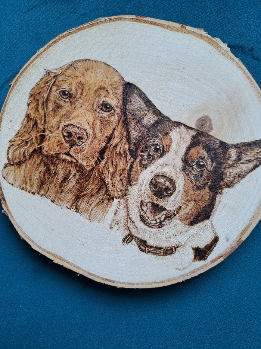 Two Dogs - spaniel and corgi burned on wood slice